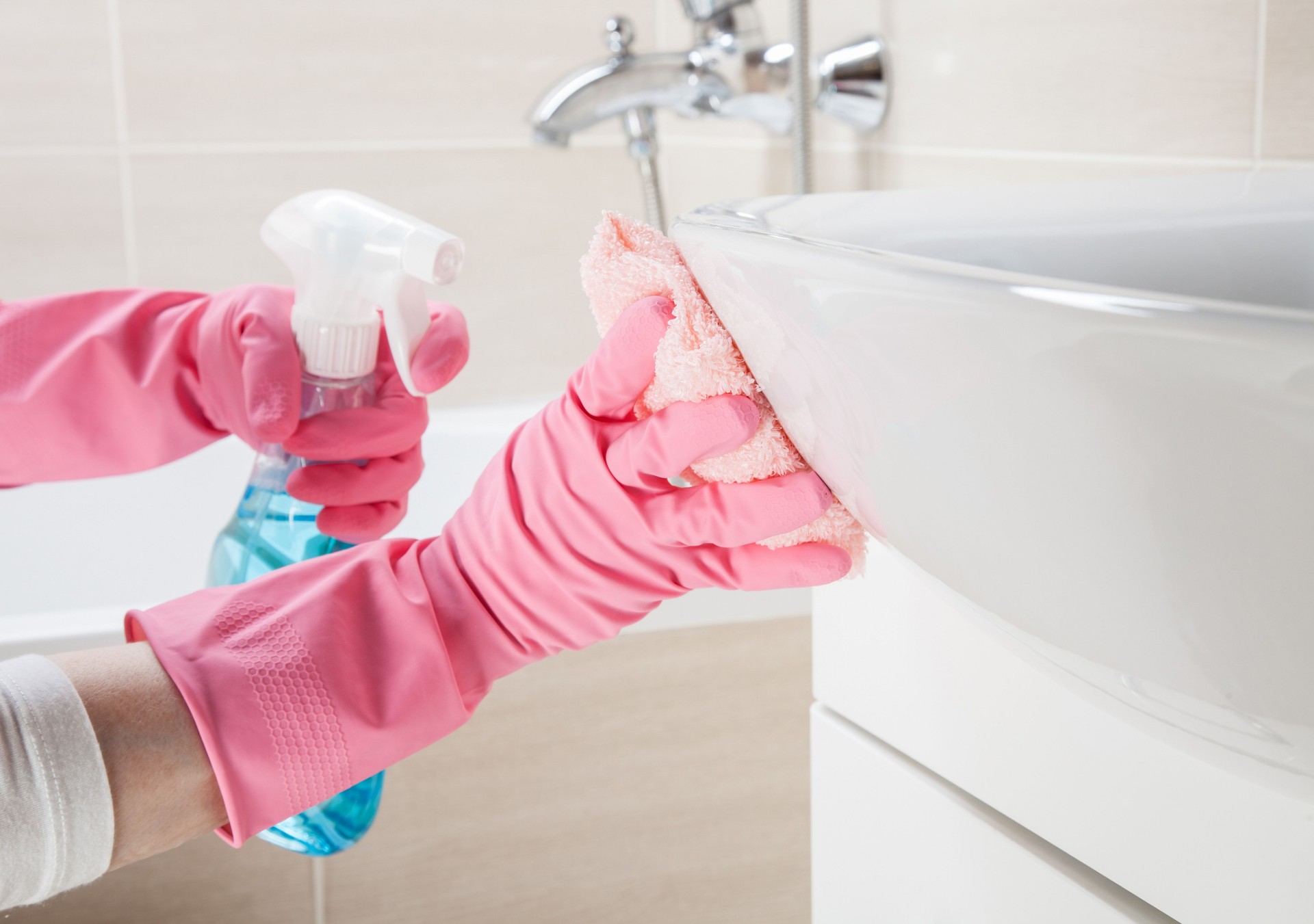 Housemaid cleaning a bathroom